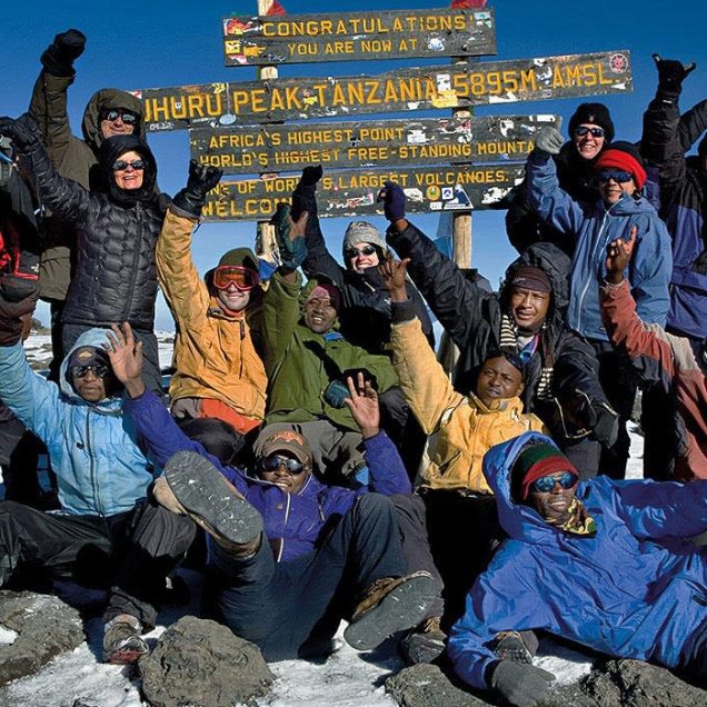 1-slide-kilimanjaro-trek-climbers-summit-pano